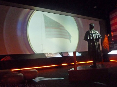 The end of the video presentation at the Fort McHenry Visitor's Center. The statue is of Francis Scott Key, and he's watching the Star Spangled Banner, still waving strong after the British bombarded the fort with rockets and guns for 25 hours.