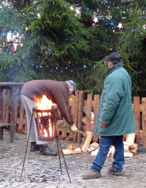 Keeping warm in Old Town Square, Český Krumlov