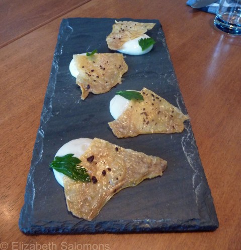 Chicken cracklin’ with hot sauce and blue cheese