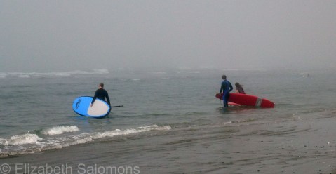 Three Surfers