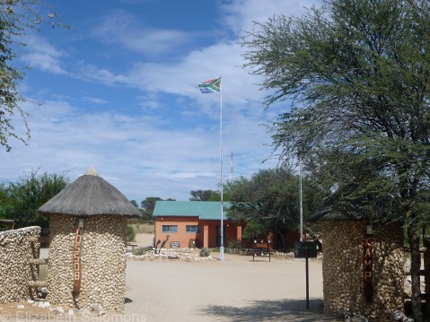 The entrance to a fenced campground on the South African side of the park